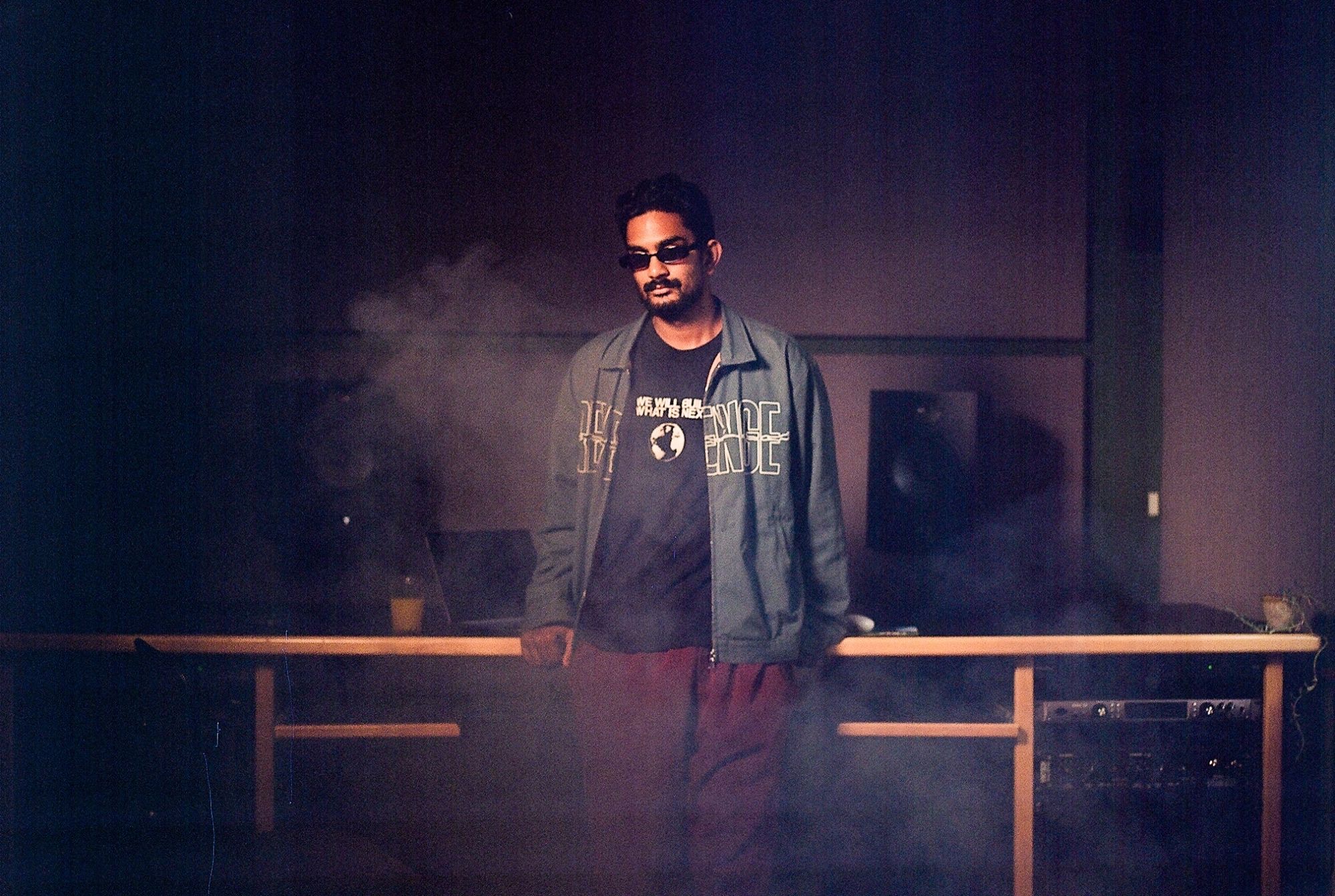 paul injeti in a smoky recording studio